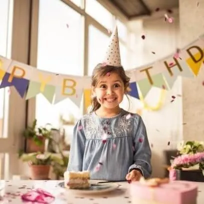 Smiling girl at her birthday party