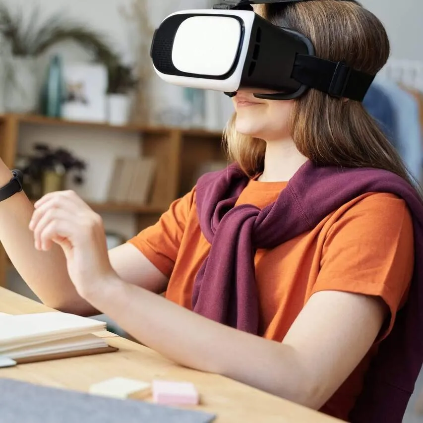 Girl exploring virtual reality with a VR headset